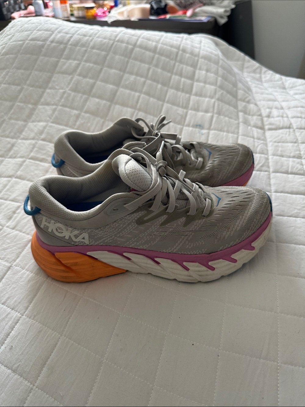 Hoka Women's Light Gray Running Shoes with Pink and Orange Accents